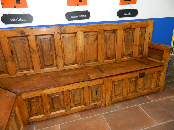 Antique L-shaped paneled Castilian choir corner bench, pine, walnut and poplar