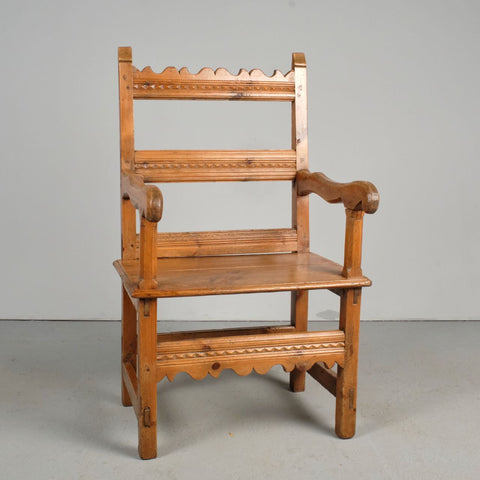 Antique carved Pyrenees arm chair, pine