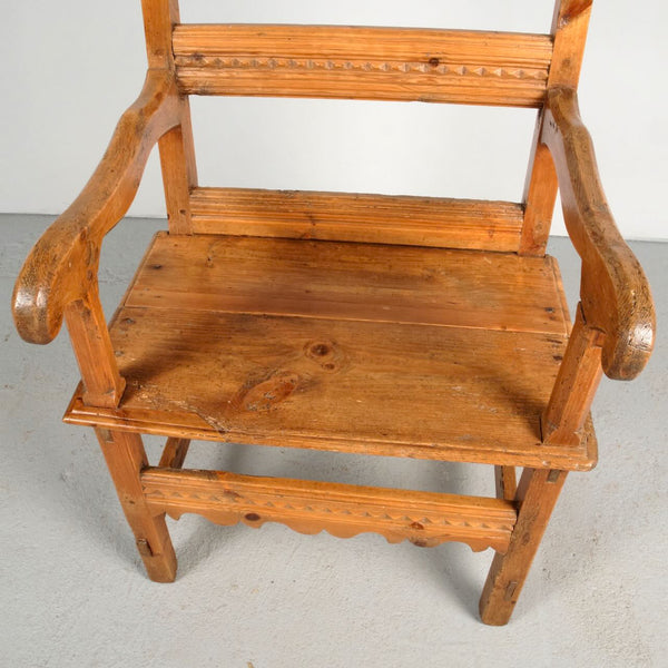 Antique carved Pyrenees arm chair, pine