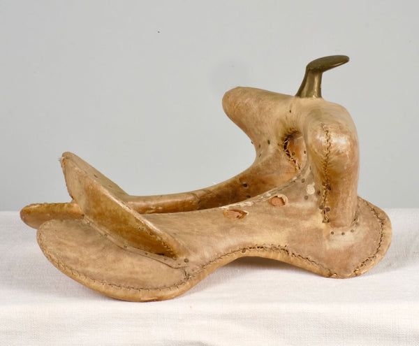 Antique leather and iron saddle