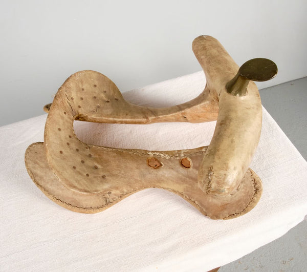Antique leather and iron saddle