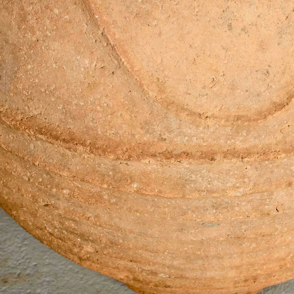 Large antique terracotta water jar with “waves”