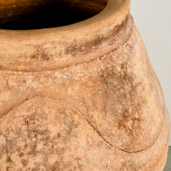 Large antique terracotta water jar with “waves”