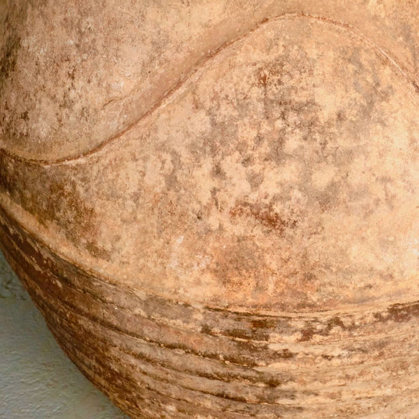 Large antique terracotta water jar with “waves”