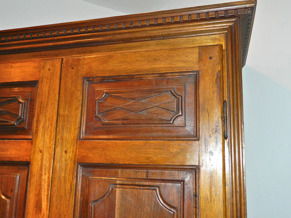 Reproduction two-door carved panel Basque armoire, walnut and cachimbo hardwood