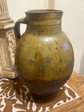 Single-handle, semi-glazed olive green oil pitcher