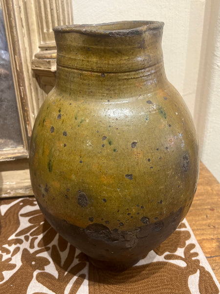 Single-handle, semi-glazed olive green oil pitcher
