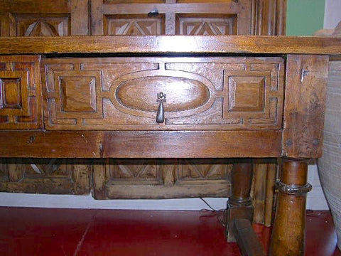 Antique carved two-drawer Castilian library table, walnut and cedar