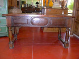Antique carved two-drawer Castilian library table, walnut and cedar
