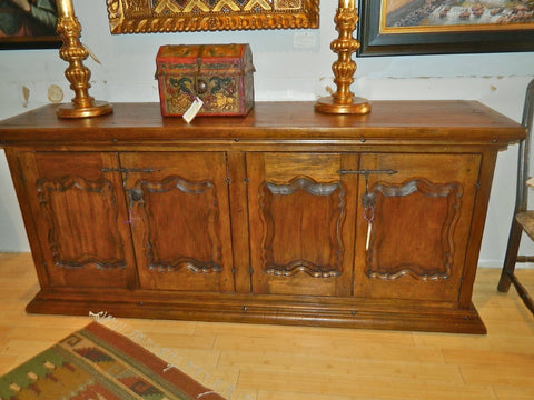 Four-door carved panel reproduction Spanish colonial sideboard / credenza, cachimbo hardwood