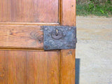 Single-panel honey pine arched door