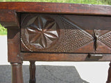 Turned-leg carved-drawer table in walnut and oak