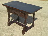 Turned-leg carved-drawer table in walnut and oak