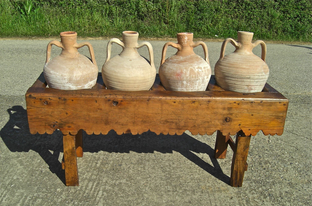 Antique scalloped skirt four-hole pine water jug stand with original clay jugs