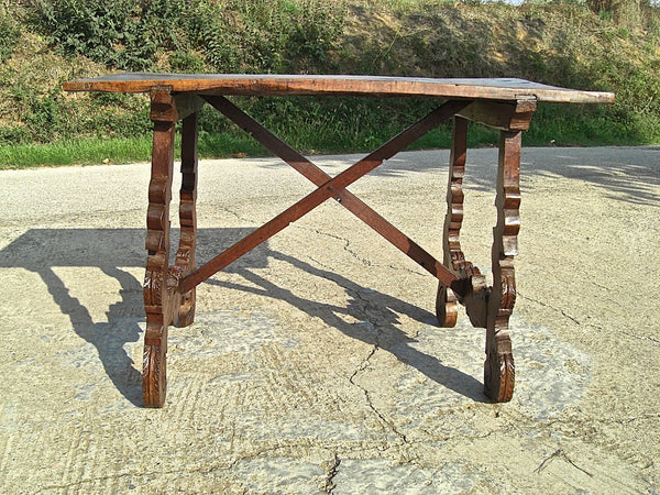 Antique scalloped lyre-leg library table with wooden stretchers, walnut