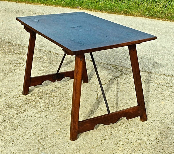 Trestle-leg campaign table with iron stretchers in walnut