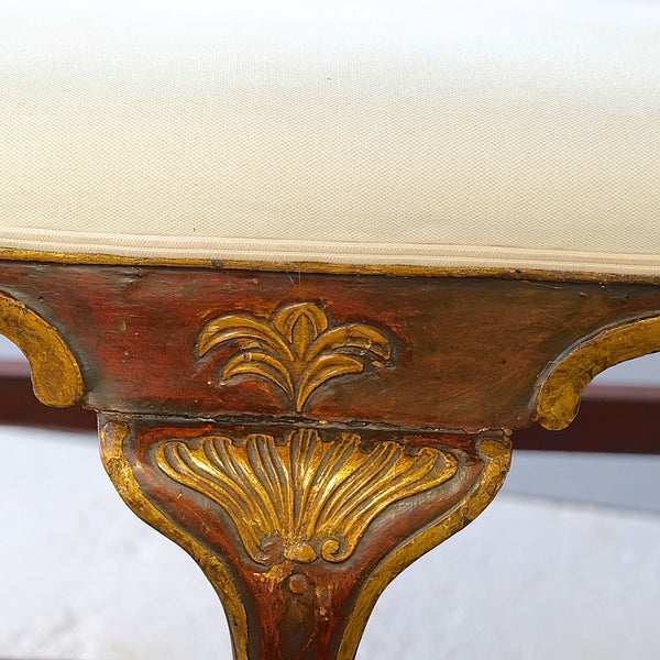 Antique painted and gilt upholstered four-seat Chippendale bench