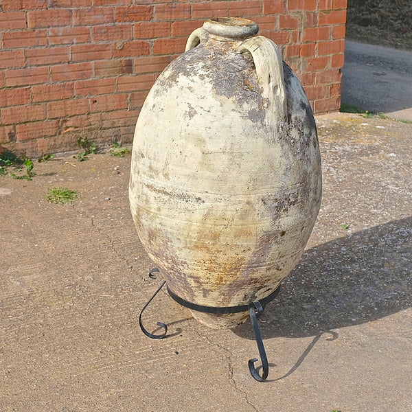 Antique large, two-handle olive oil jar with iron base