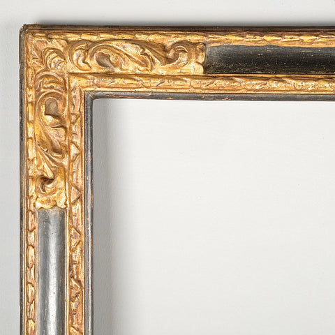 Antique carved, painted and gilt mirror frame