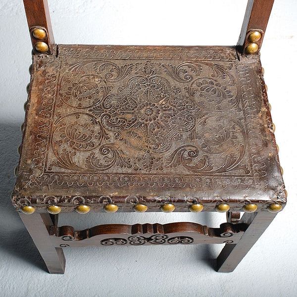 Pair of antique tooled leather Spanish colonial chairs, walnut