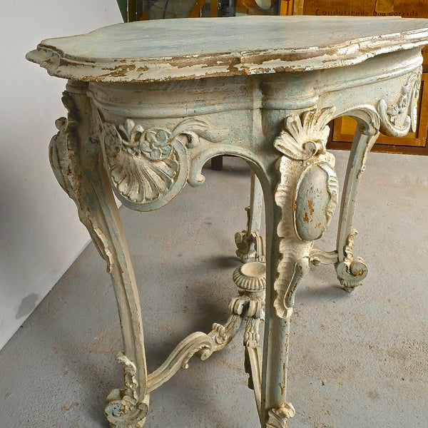 Antique carved and painted oval “tortoise” table, pine