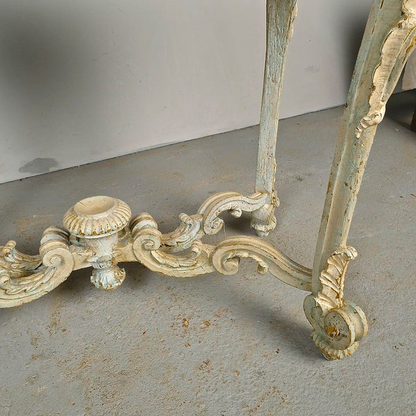 Antique carved and painted oval “tortoise” table, pine