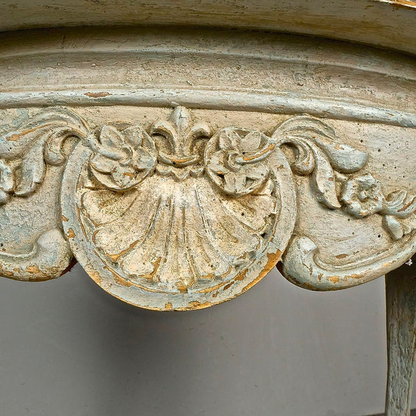 Antique carved and painted oval “tortoise” table, pine