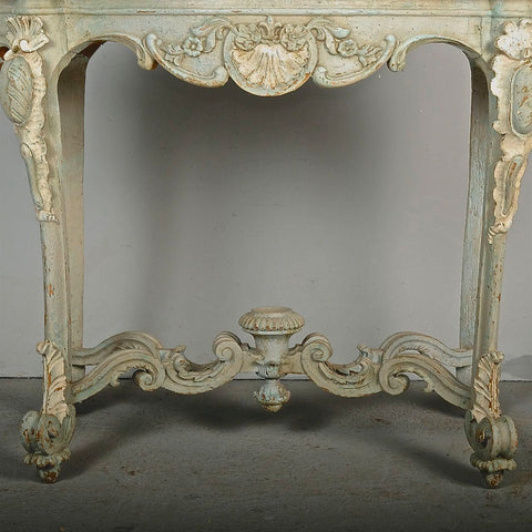 Antique carved and painted oval “tortoise” table, pine