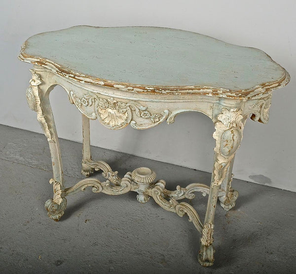 Antique carved and painted oval “tortoise” table, pine