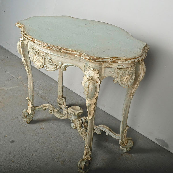 Antique carved and painted oval “tortoise” table, pine