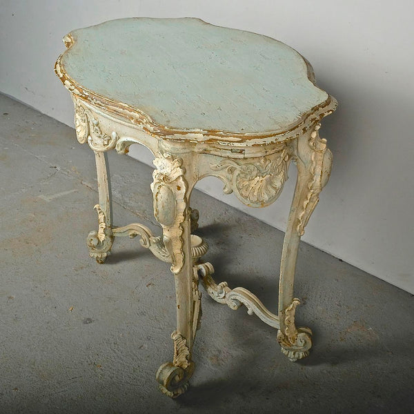 Antique carved and painted oval “tortoise” table, pine