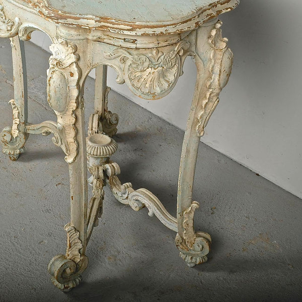 Antique carved and painted oval “tortoise” table, pine