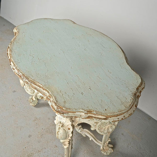Antique carved and painted oval “tortoise” table, pine