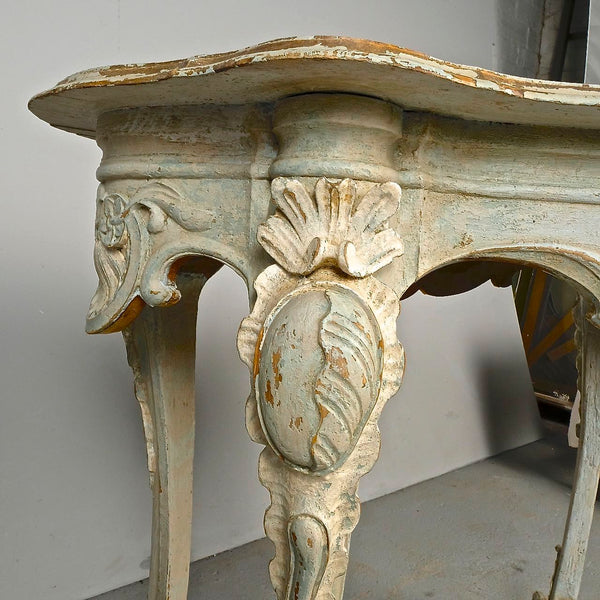 Antique carved and painted oval “tortoise” table, pine