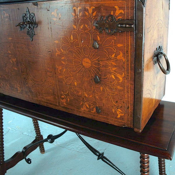 Antique inlaid vargueño on lentil leg table with iron stretchers