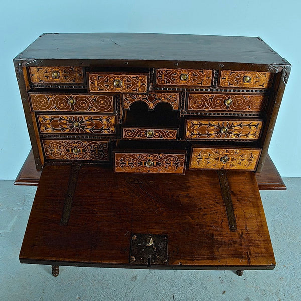 Antique inlaid vargueño on lentil leg table with iron stretchers