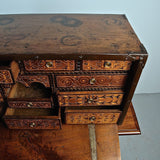 Antique inlaid vargueño on lentil leg table with iron stretchers