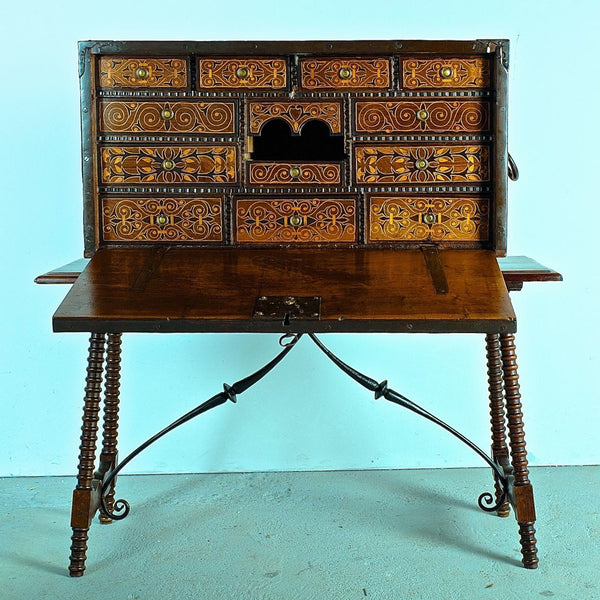 Antique inlaid vargueño on lentil leg table with iron stretchers
