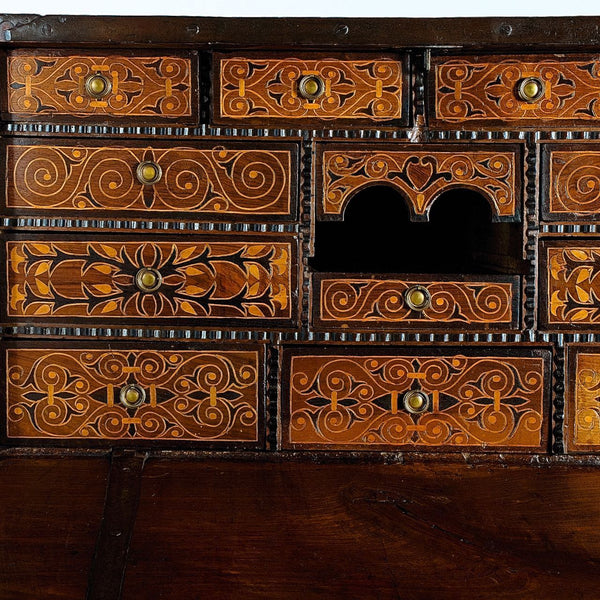 Antique inlaid vargueño on lentil leg table with iron stretchers