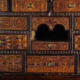 Antique inlaid vargueño on lentil leg table with iron stretchers