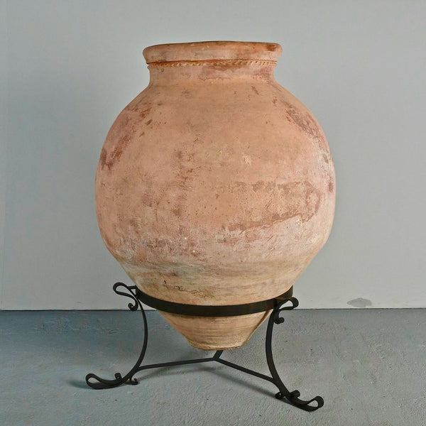 Antique large incised “Arabesque” oil jar on iron stand