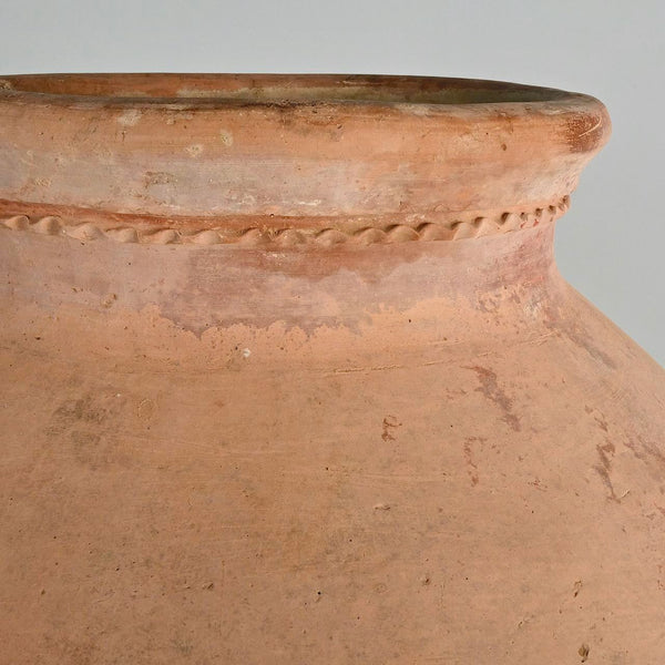 Antique large incised “Arabesque” oil jar on iron stand