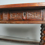 Antique carved three-drawer library table with beaded turned legs, walnut