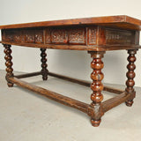 Antique carved three-drawer library table with beaded turned legs, walnut