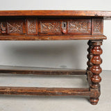 Antique carved three-drawer library table with beaded turned legs, walnut