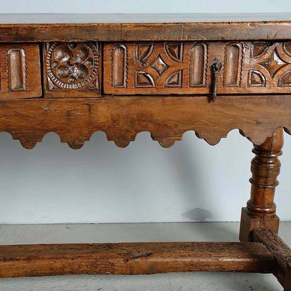 Antique carved two-drawer scalloped skirt library table, walnut