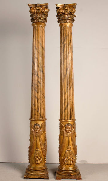 Antique pair of carved and gilt wooden columns, pine