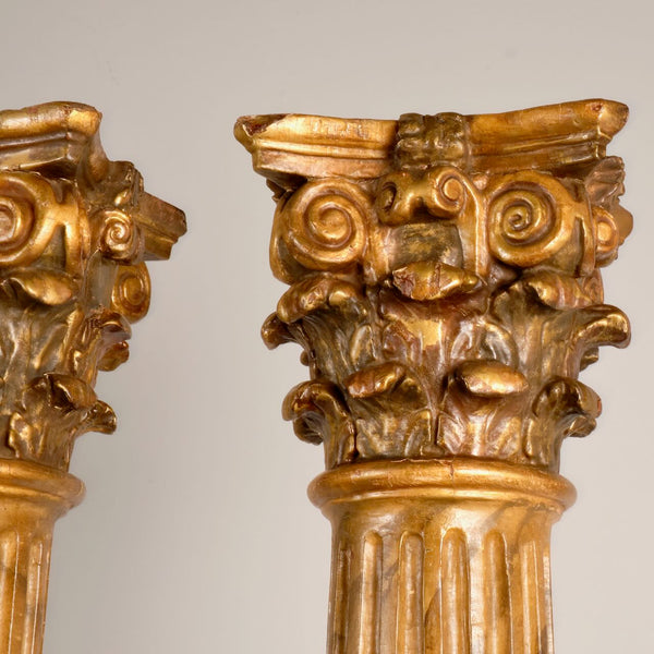 Antique pair of carved and gilt wooden columns, pine