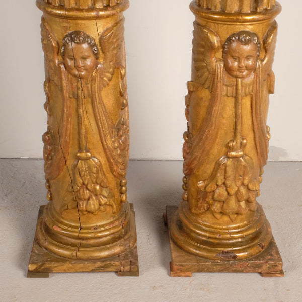 Antique pair of carved and gilt wooden columns, pine