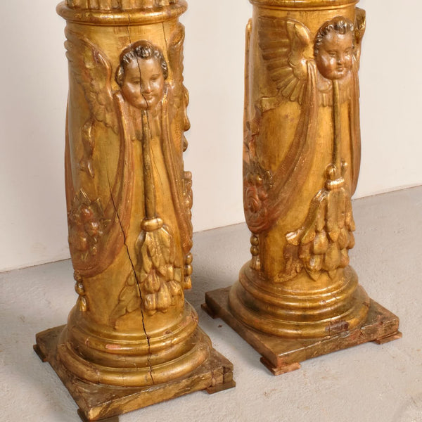 Antique pair of carved and gilt wooden columns, pine